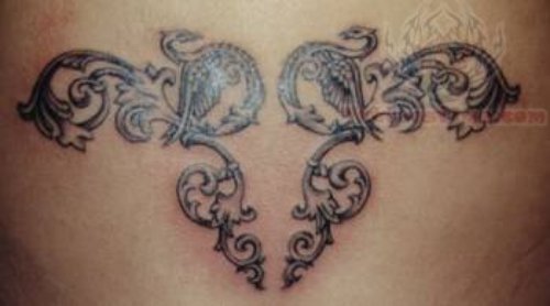 Winged Tribal Lower Back Tattoo